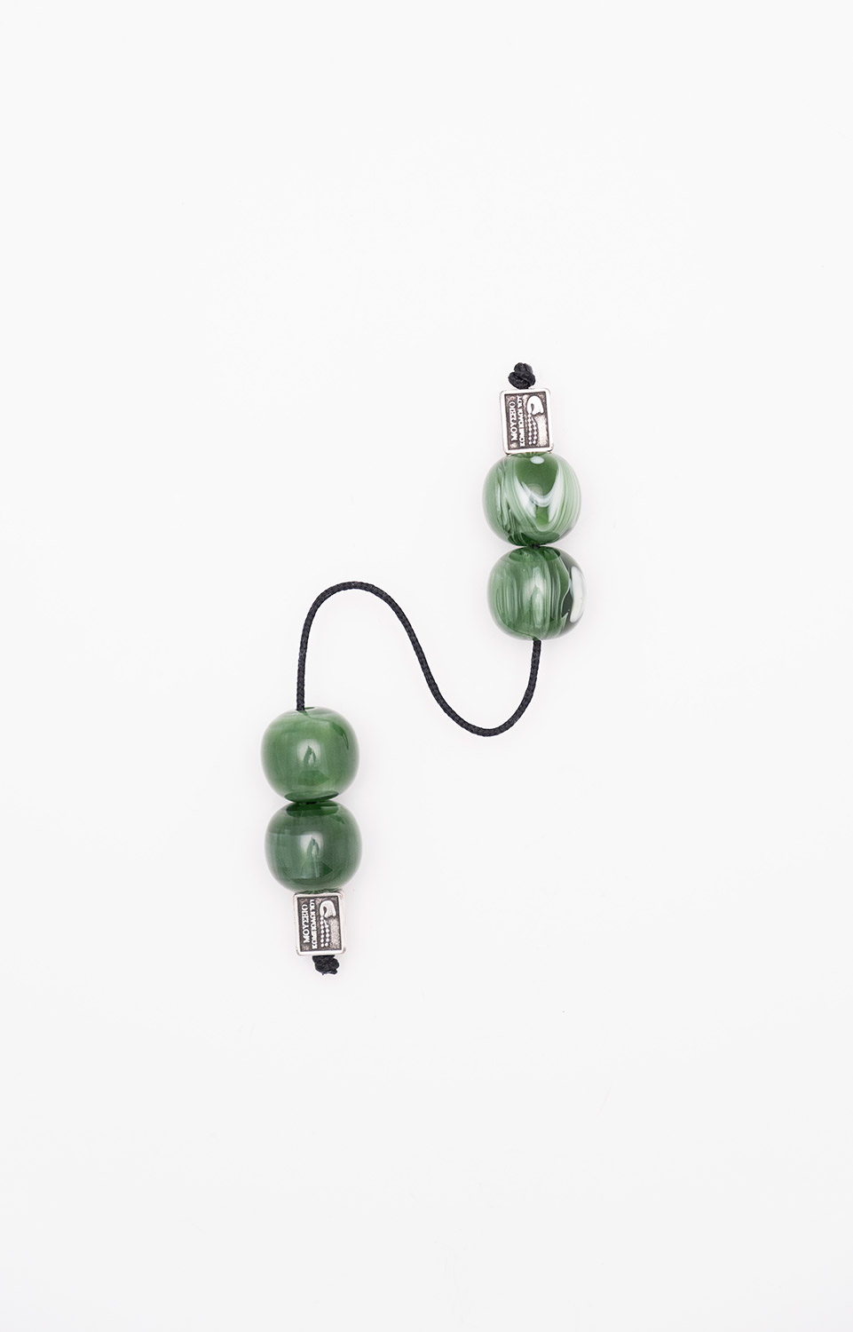 Begleri made of artificial resin (green with water-like shades)