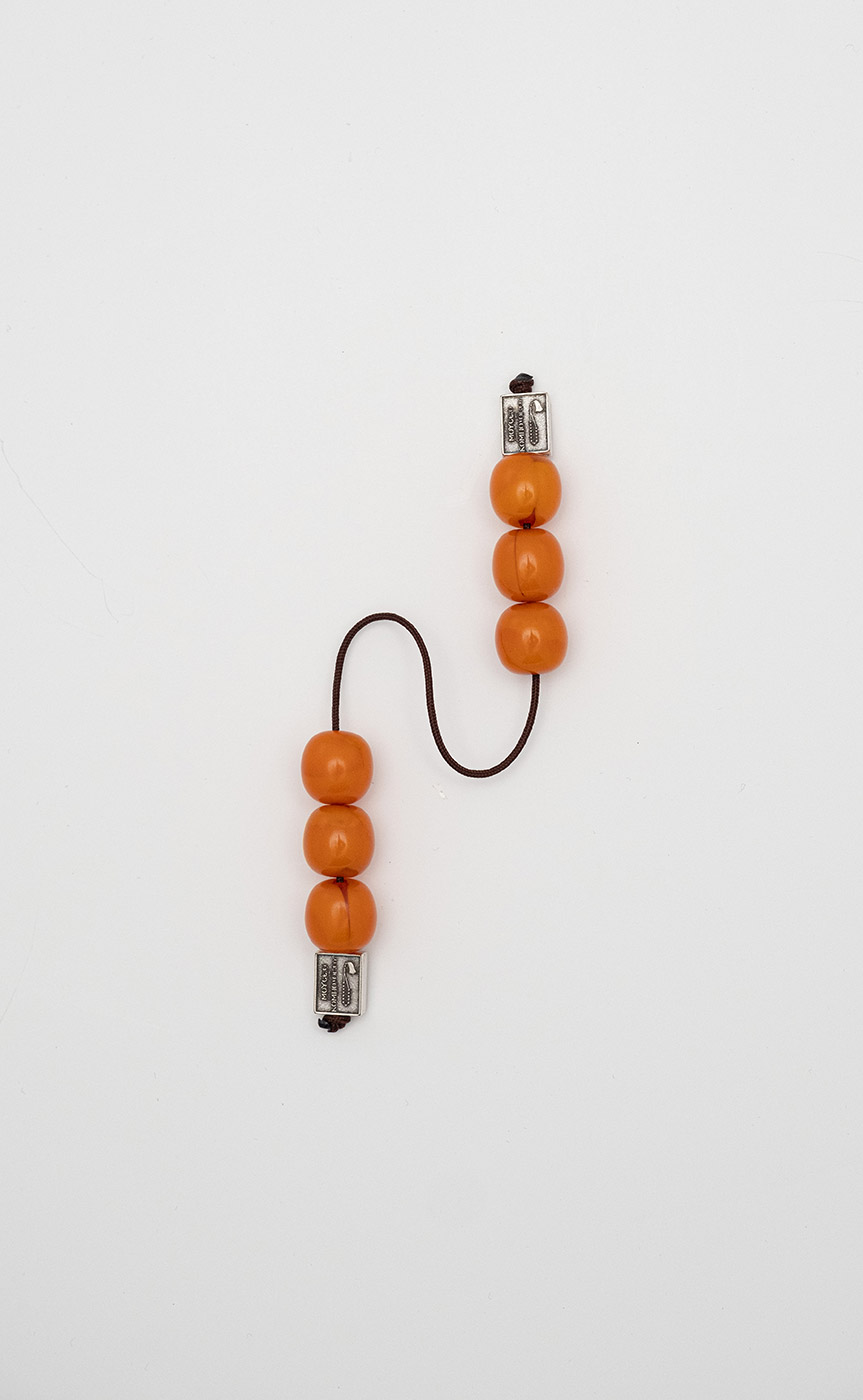 Begleri made of artificial resin (orange with water-like shades)