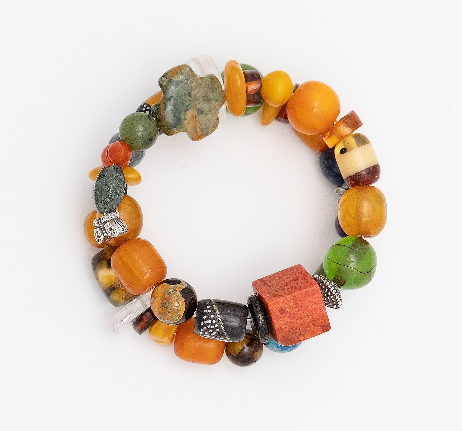 Bracelet with beads made of old mixture of artificial resins of Egypt (1960), Baltic Sea Amber (cut by hand and Ambroid), Ebony with inlaid silver and artificial resin,Water buffalo Horn with inlaid silver and bronze, Agates and tin

