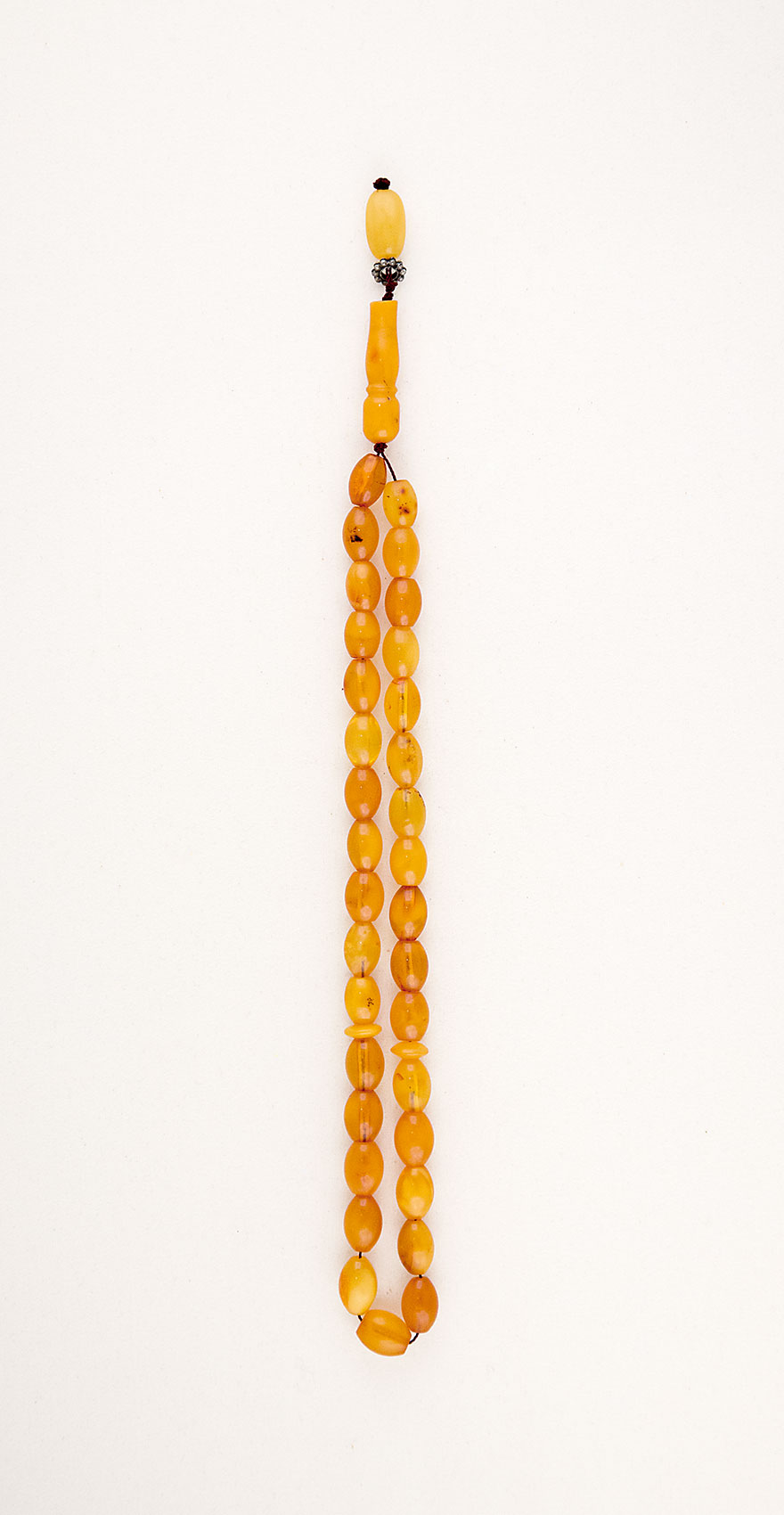 Muslim Prayer beads  made of genuine amber from Baltic sea (cut by hand) and tin