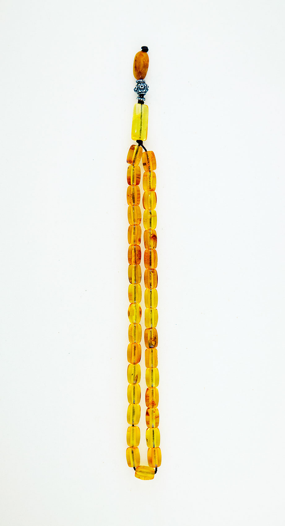 Muslim Prayer beads  made of amber from Baltic sea  (cut by hand) and tin